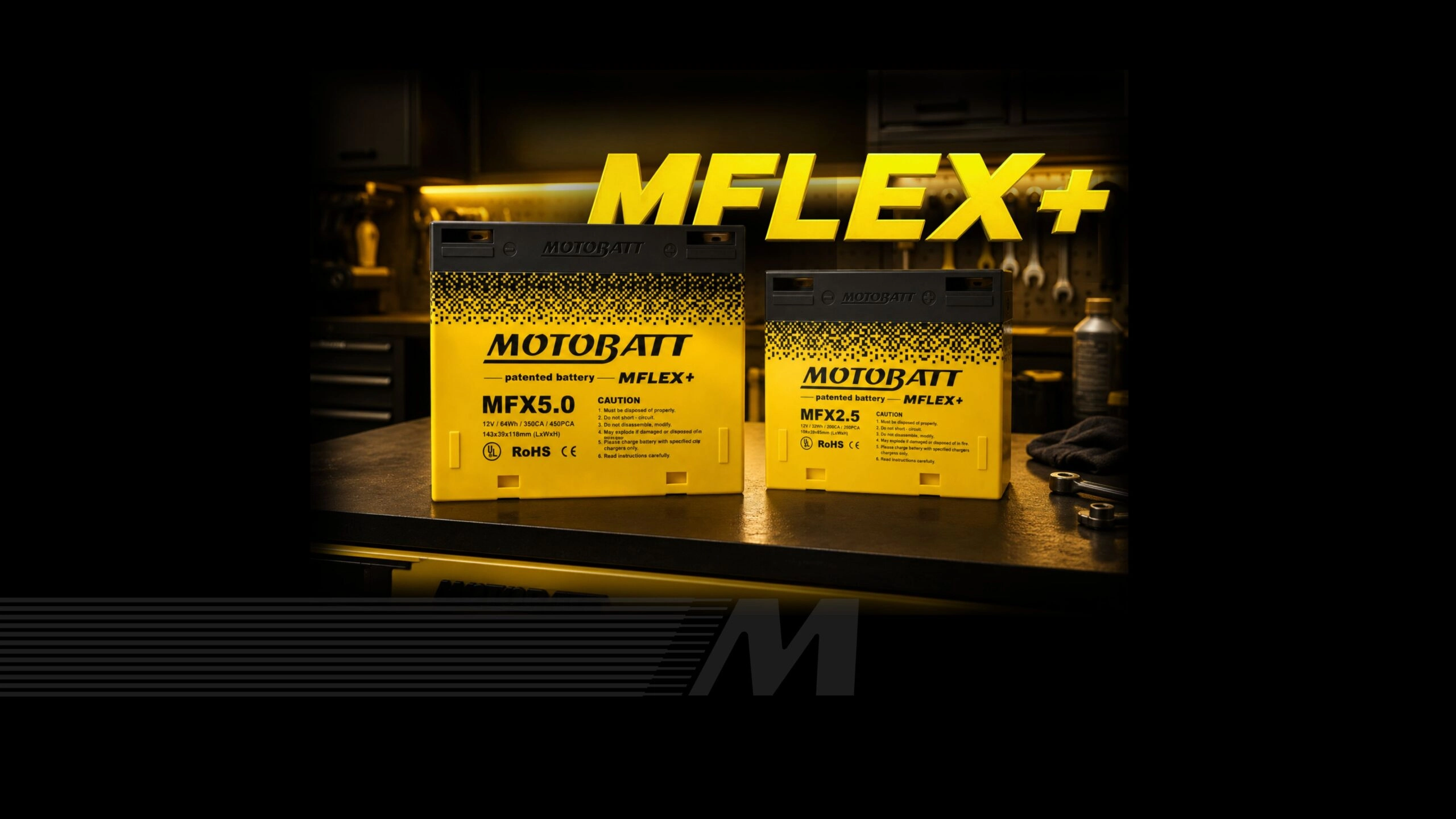 Motobatt MFLEX+ MFX5.0 and MFX2.5 modular lithium batteries on a workbench